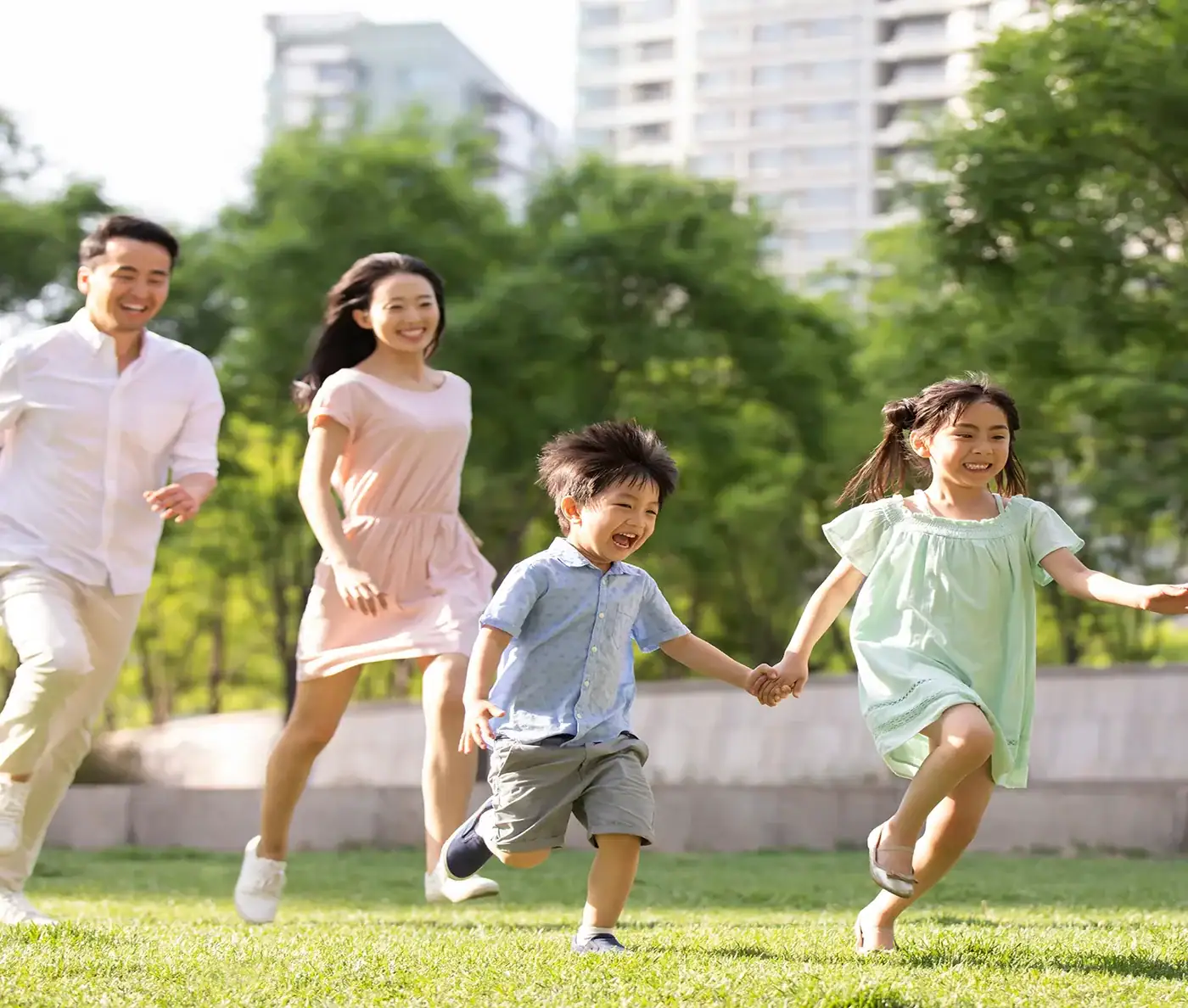 Family Walking Through A Mission Point Park